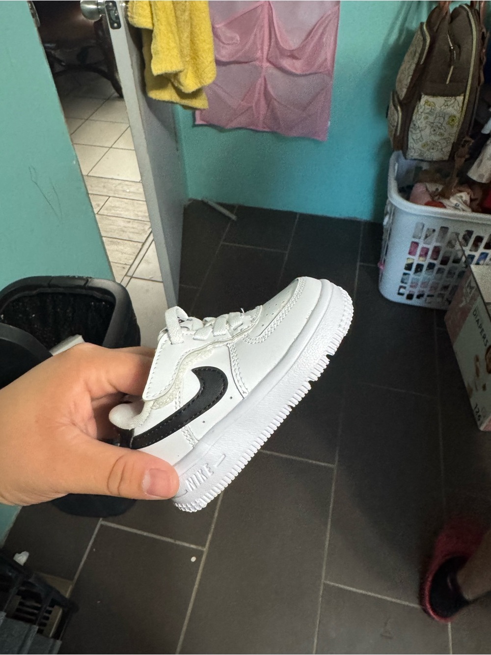 Nike White Low-Top Sneaker with Black Swoosh